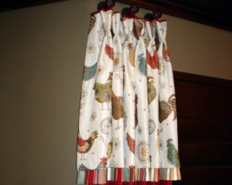 This decorative valance is actually attached to the body fabric at the top and is part of the pleat